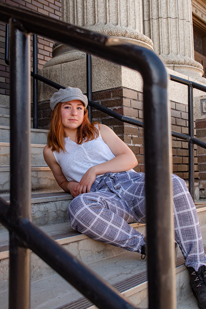 young woman sitting on stairs